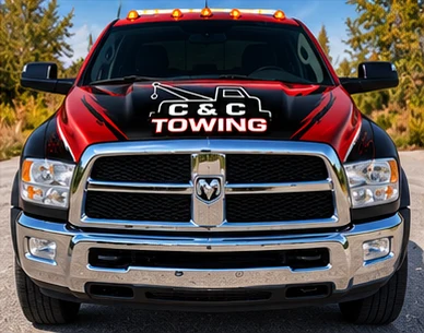 Front view of the C&C Towing red flatbed truck
