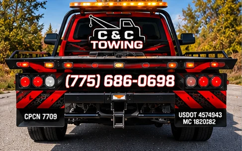 Rear view of the C&C Towing flatbed truck